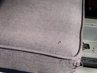 Seat_cushion_piping_detail,_and_minor_damage