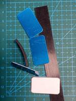 Adhesive metal strips and rubber strips